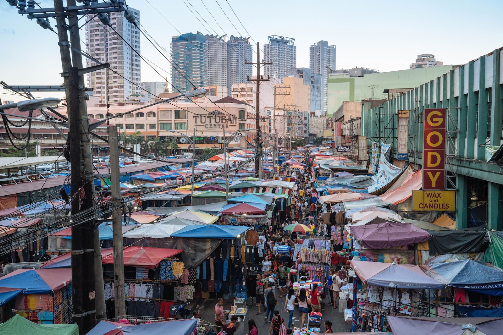 Contrast between skyscrapers and Divisoria Market