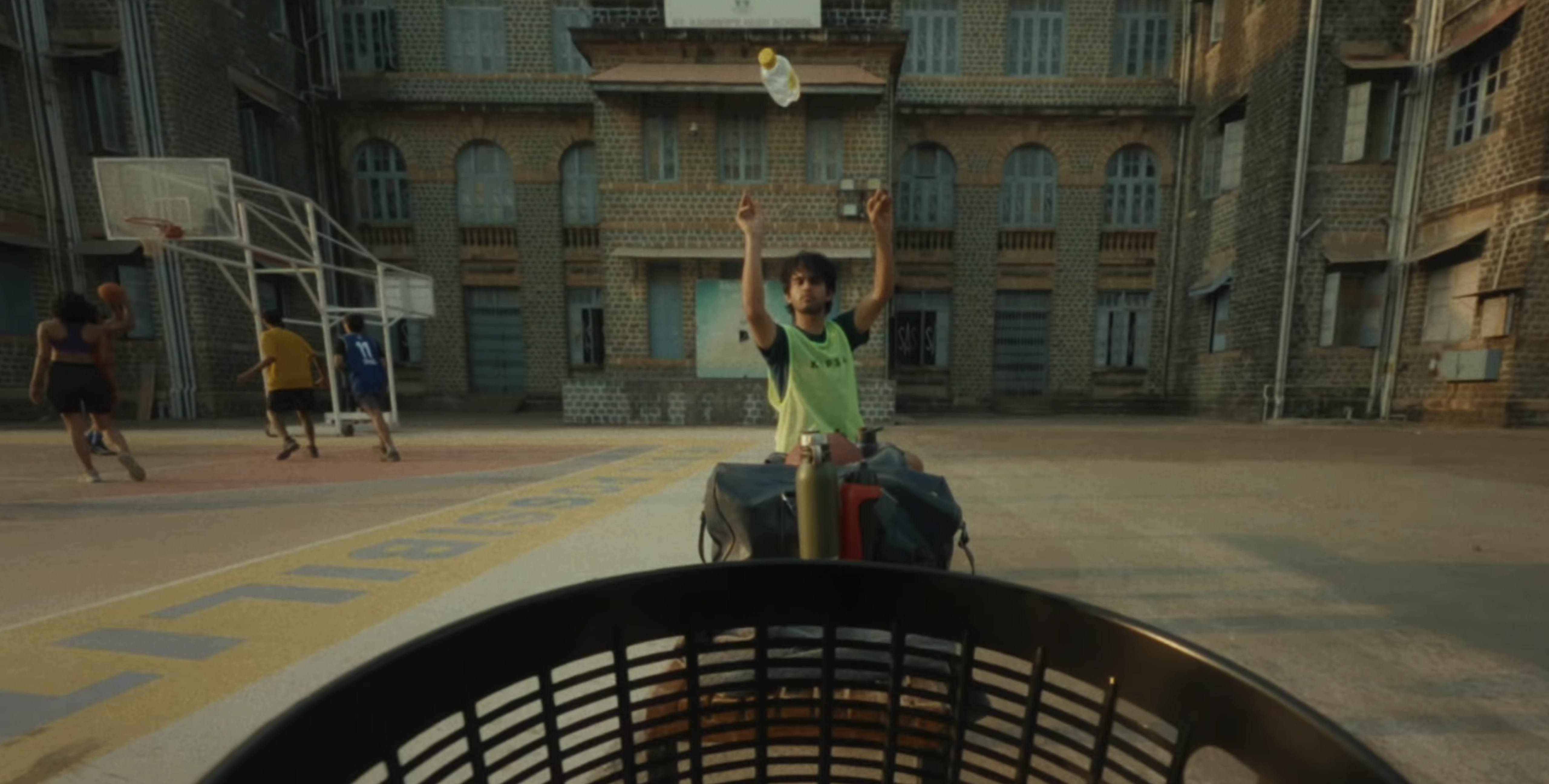 Scene from Video: Boy throwing bottle into bin