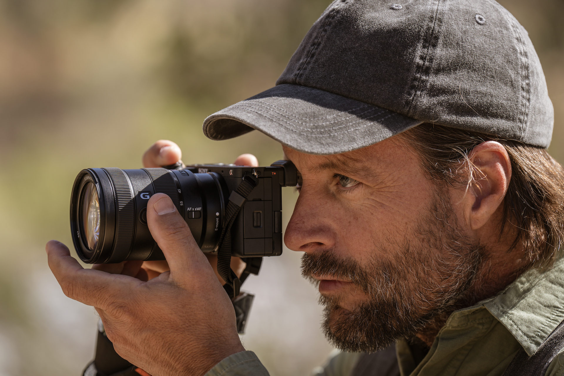 Man shooting outdoors with Sony Alpha 6700 in hand